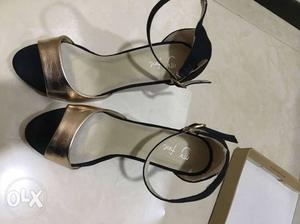 Pair Of Gray-and-black Ankle Strap Sandals