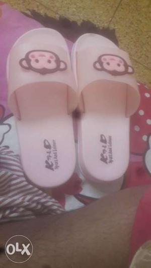 Pair Of Pink Slide Sandals