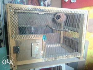 Strong wooden cage with accessory. 3 side window