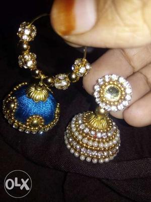 Two Blue And Gold-colored Jhumka Earrings