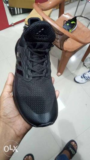 Unpaired Black Adidas Shoe