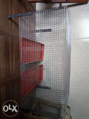 Unused cage for pets with the tray