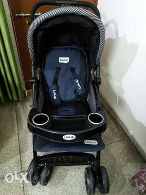 Baby's Black And Blue Stroller