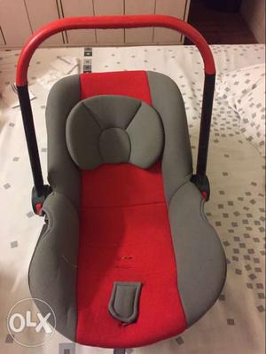 Baby's Gray And Red Car Seat Carrier