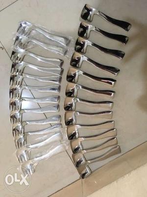Heavy stainless steel. brand new. 12 spoons and 12 forks
