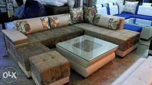 L shape sofa with table and puffy