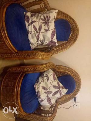 Two Brown Wicker Framed Blue Armchairs