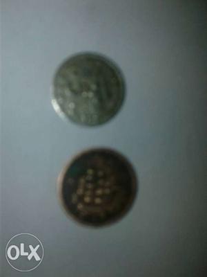 Coins of England and Malaysia of year 