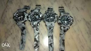 Four Gray And Black Chronograph Watches With Camo Straps