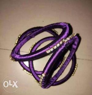 Four Purple Silk Thread Bangles