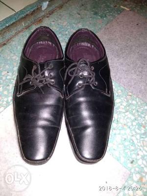 Pair Of Black Leather Dress Shoes