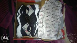Pair Of Black-and-white Basketball Shoes With Box