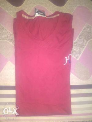 Red brown color t-shirt.