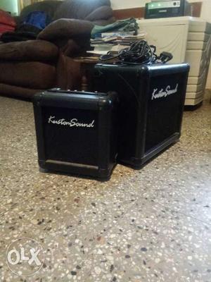 Two Black Guitar Amplifiers with mic and cord