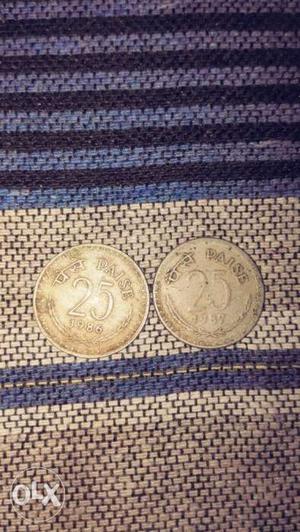 Two Gold-colored 25 Indian Paise Coins