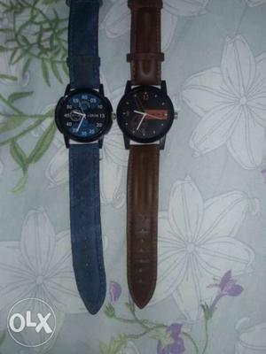Two Round Blue And Brown Chronograph Watches With Straps