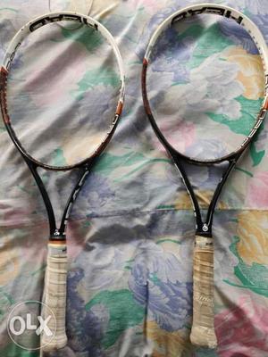 Two White-and-black Tennis Rackets
