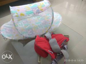 A foldable sleeping net with baby carrier