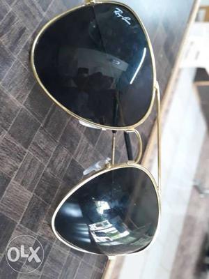 Black colour specs with gold colour frame.