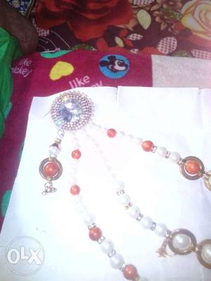 Broach for sari with orange and white Pearls