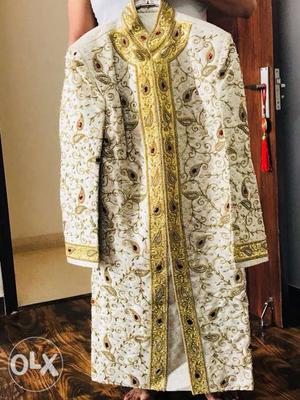 Cream beige Royal Sherwani with complete Golden Embroidery