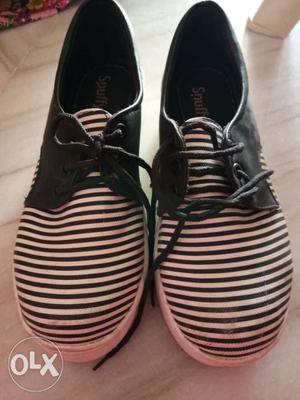 Pair Of Black-and-white Stripe Shoes for girls with heals