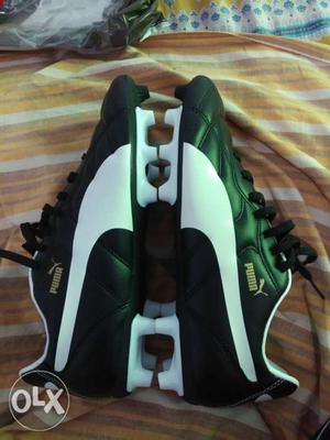 Pair Of Green-and-white PUMA Cleats