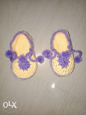 Two Pairs Of Purple And Pink Knitted Shoes