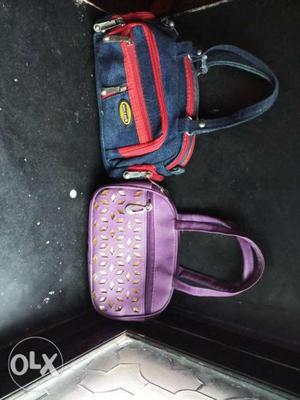 Two Women's Blue And Purple Tote Bags