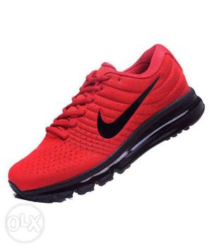 Unpaired Red And Black Nike Running Shoe