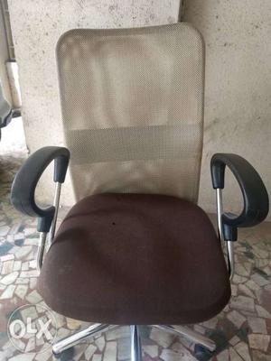 Office chair with proper backrest and arm rest..