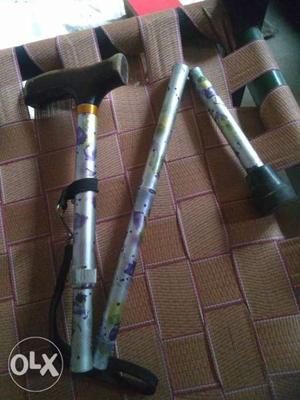 Silver And Black Folding Cane