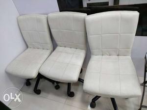 Three White Leather Padded Chairs