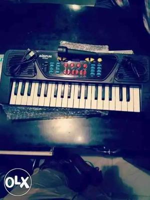 Blue And White Electronic Keyboard