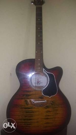 Brown And Red Acoustic Guitar