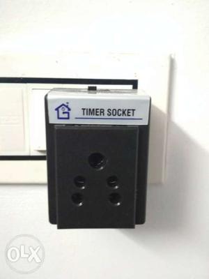 Gray And Black Timer Socket Device