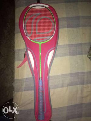 Gray And Green Badminton Racket With Red Bag