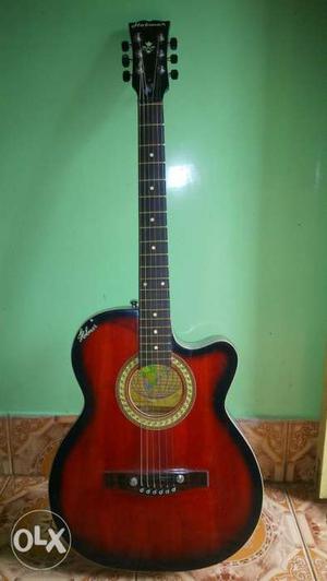 Red And Black Burst Acoustic Guitar