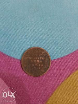 Round Copper-colored Indian Quarter Anna Coin