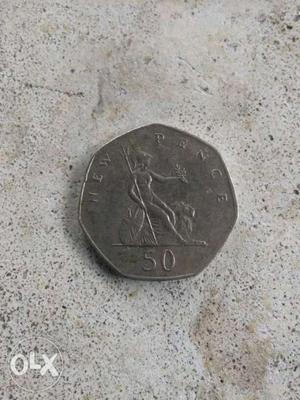 Silver-colored 50 Pence Coin