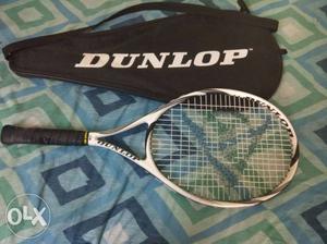 White Dunlop Tennis Racket With Black Handle And Bag