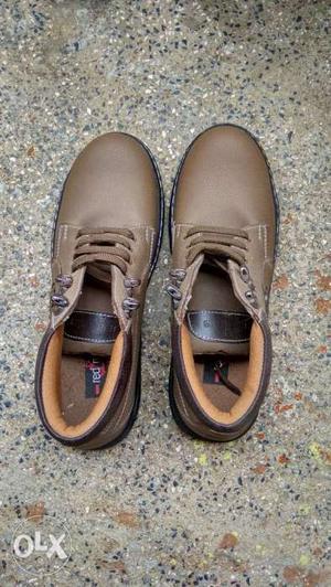 Pair Of Brown Leather Shoes