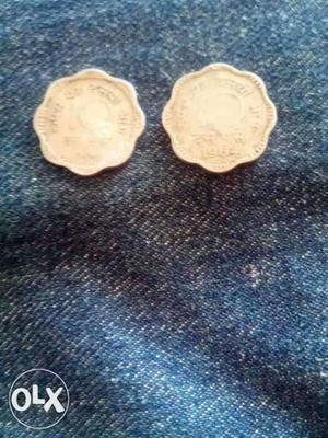 Two Scallop Silver-colored Coins