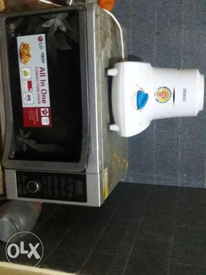 White Electric Blender And Gray Microwave Oven