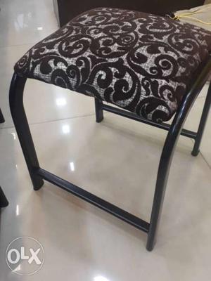 Black Metal Framed White And Black Floral Padded Chair