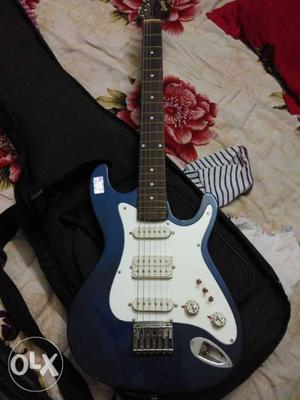 Blue, White, And Brown Electric Guitar With Bag