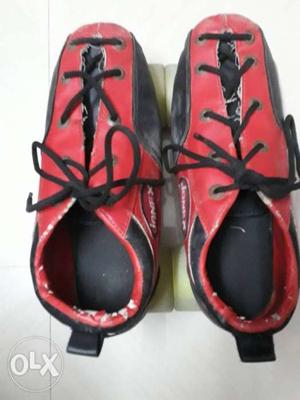 Pair Of Red-and-black Adidas Cleats