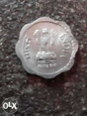 Scalloped-edge Silver-colored Indian Piase Coin