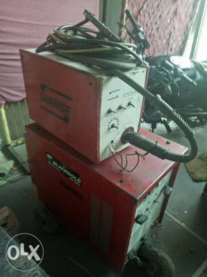 Two Red-and-white Welding Machines