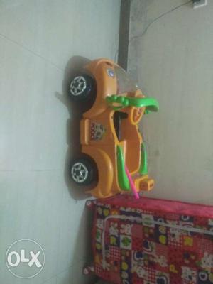 Yellow And Green Plastic Toy Car